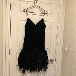 Custom little black dress with feathers.